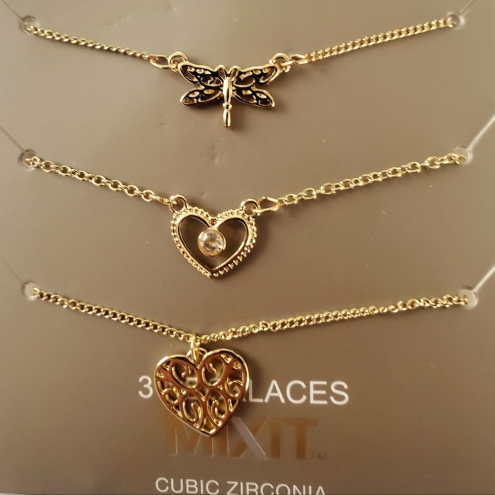 3 pairs of Mixit brand necklaces with different pendants.